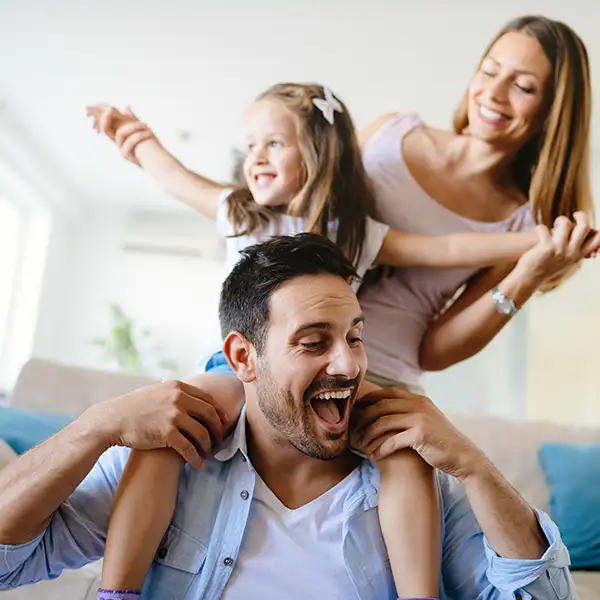 Happy smiling family of three 