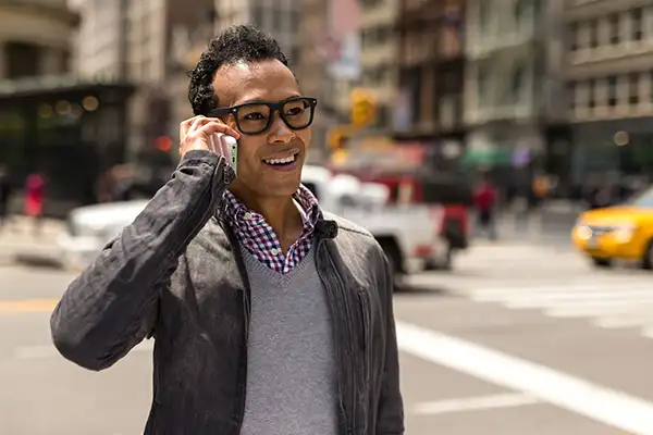 Young man using his phone to call